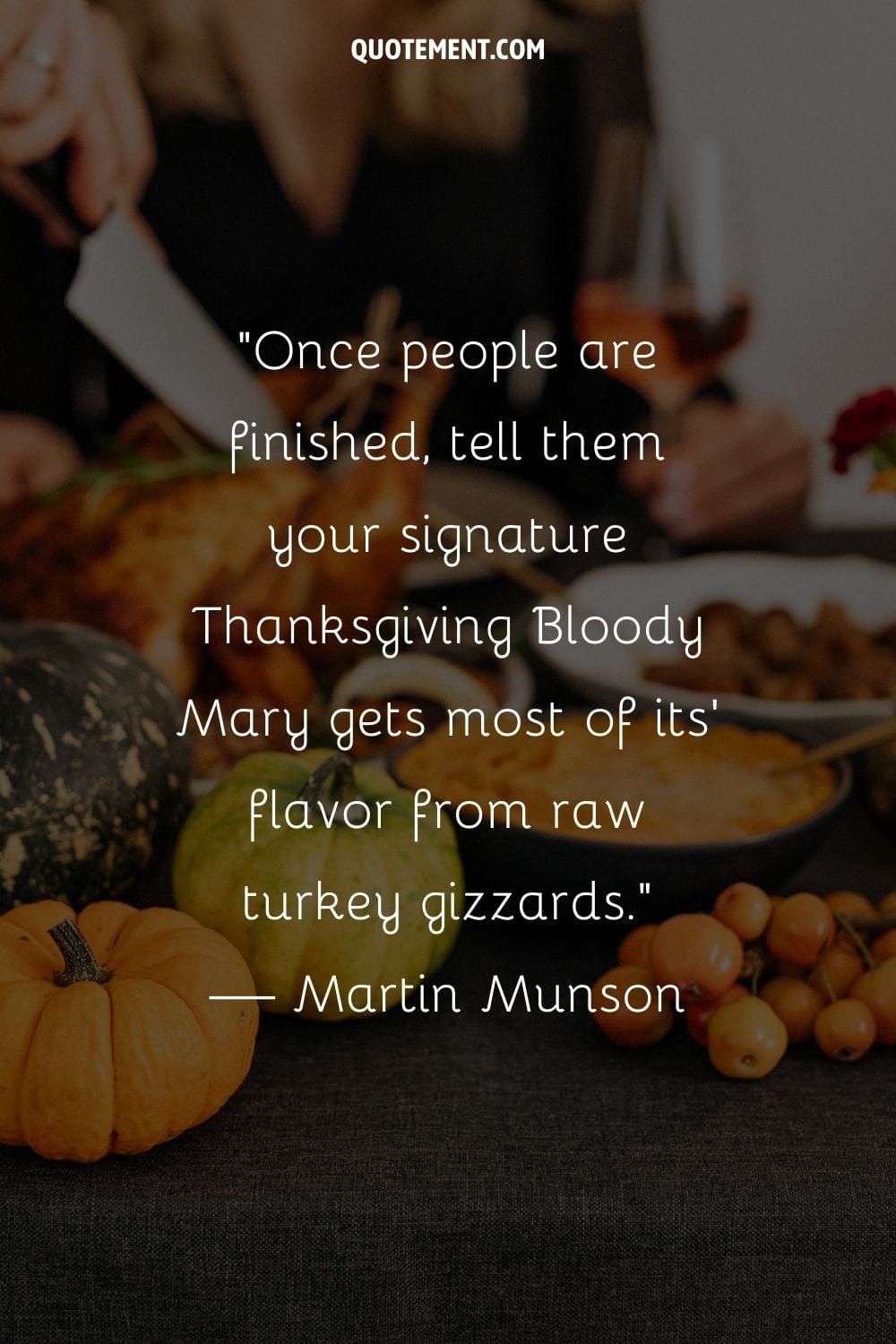 a hand slices the Thanksgiving turkey amid holiday decor