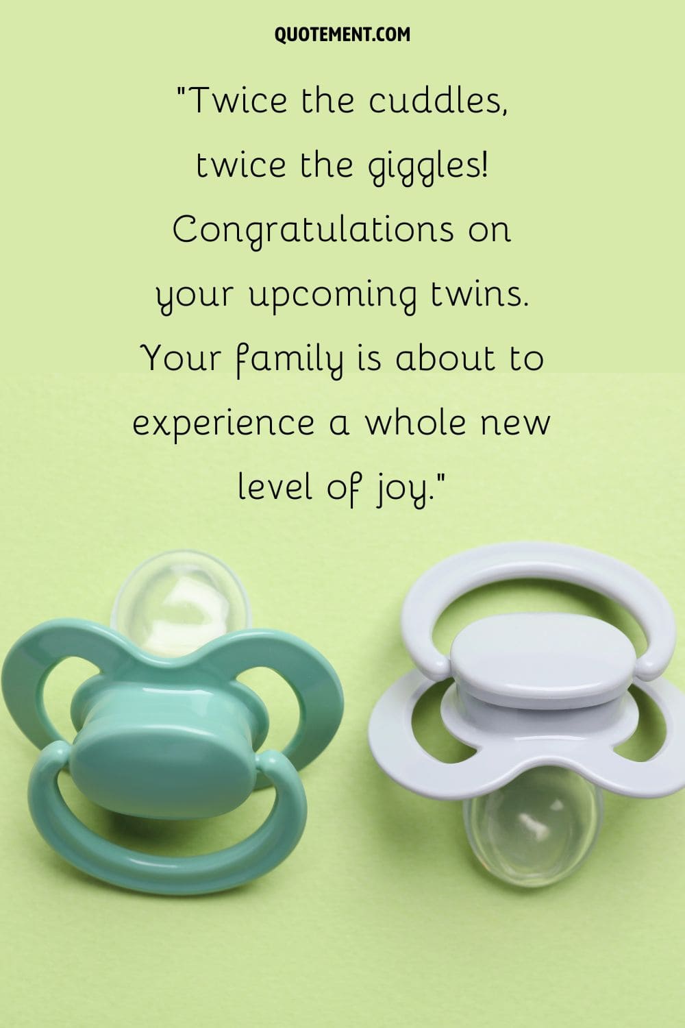a pair of pacifiers on a green background