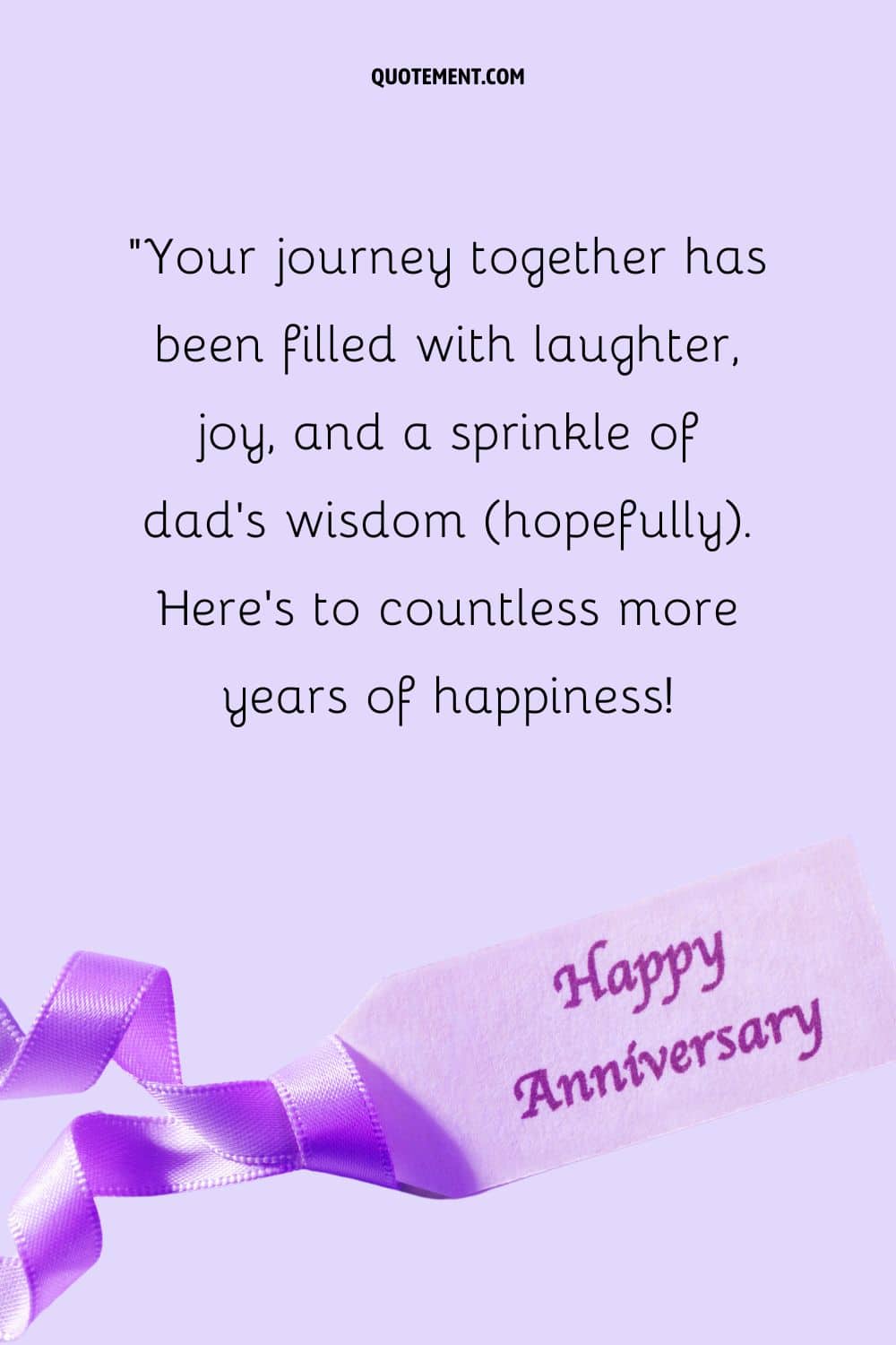 happy anniversary message on paper with purple ribbon
