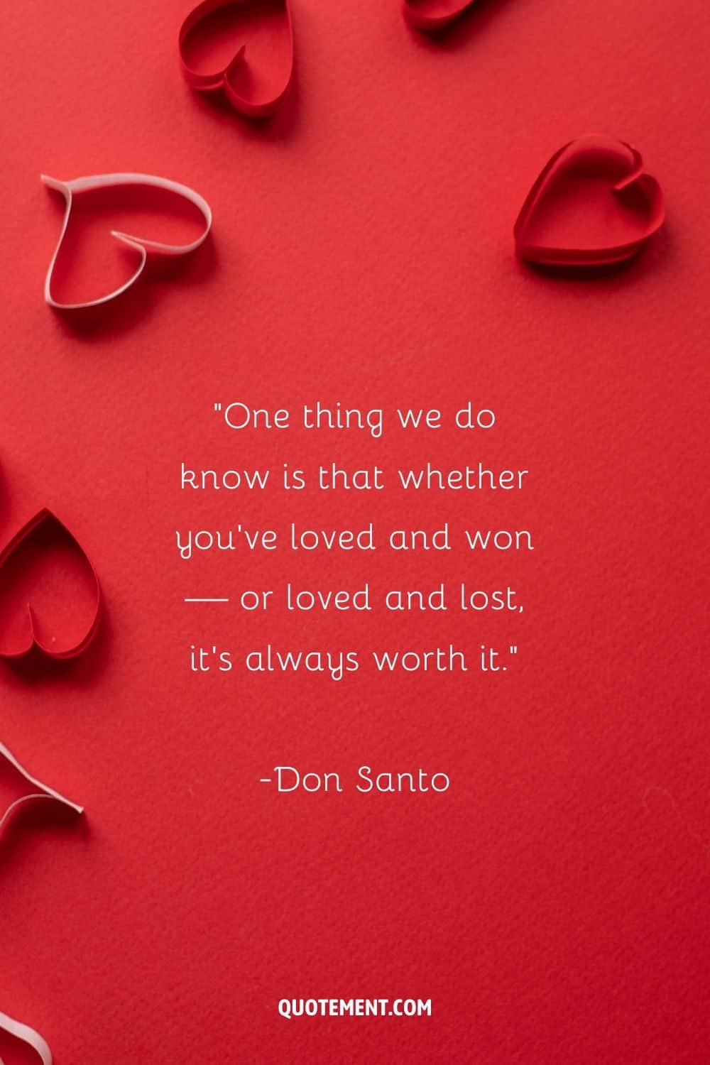paper hearts arranged on a vibrant red surface representing the greatest lost love quote