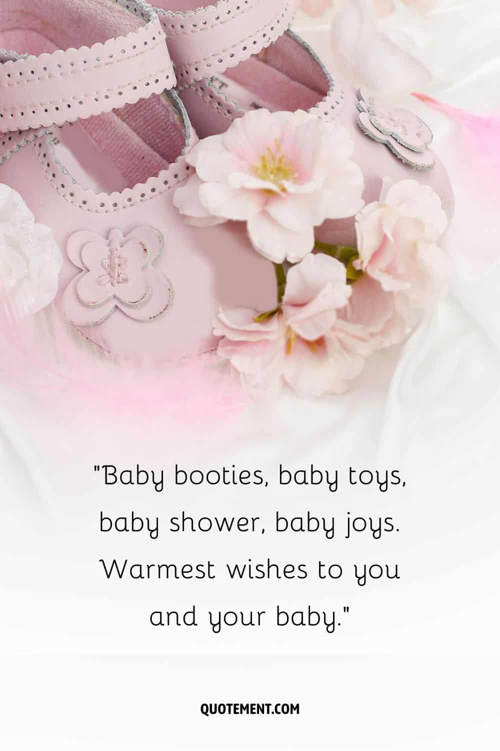 pink baby girl shoes and flowers
