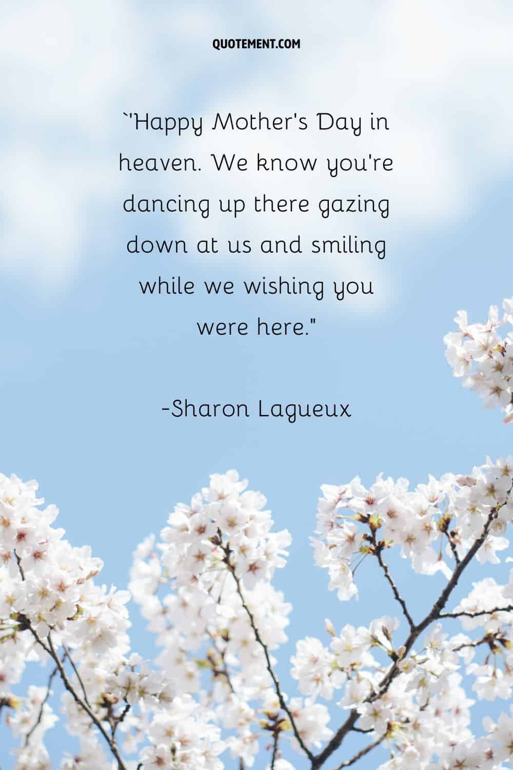white blossoms under a blue sky representing a beautiful happy mother's day in heaven quote

