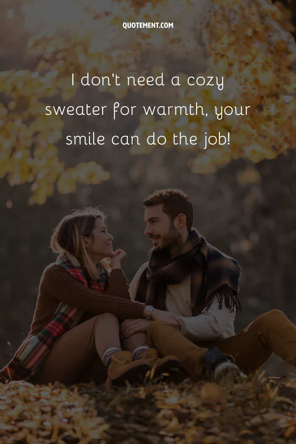 young couple sitting on the leaf-covered ground  representing the best autumn pick up line