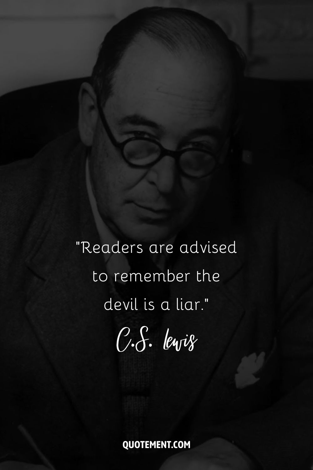 C.S. Lewis adopts a focused stance, pen in hand and glasses on