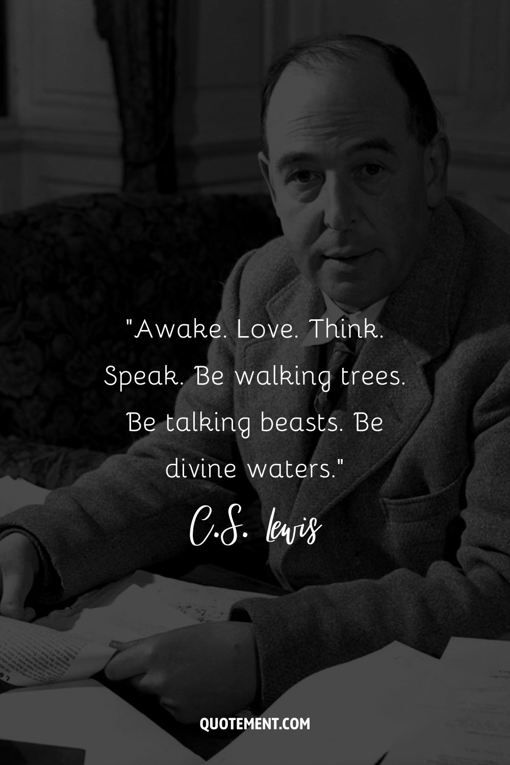 C.S. Lewis holding a script in his hand representing the best C.S. Lewis quote
