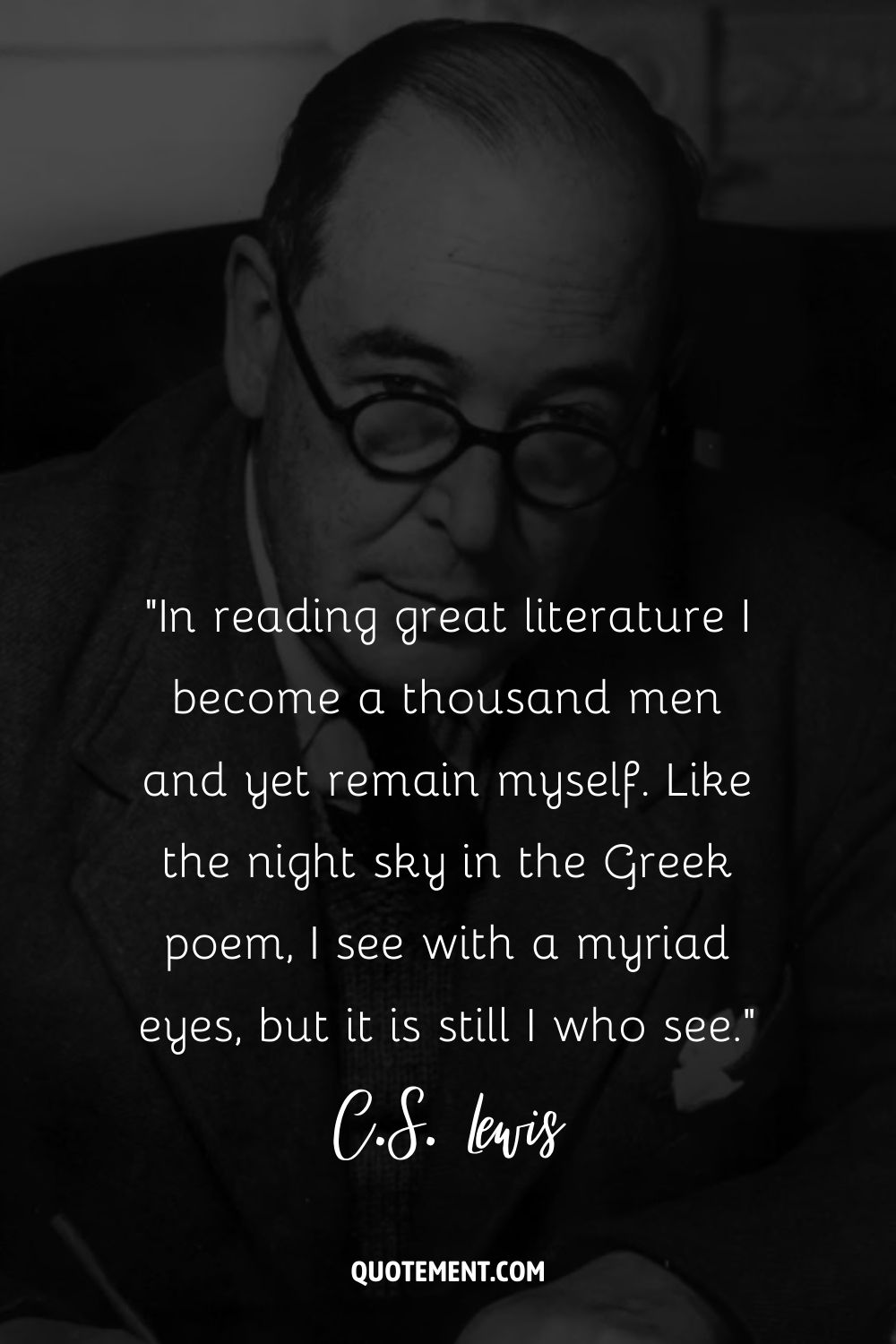 C.S. Lewis sits in thoughtful pose, pen in hand and glasses on