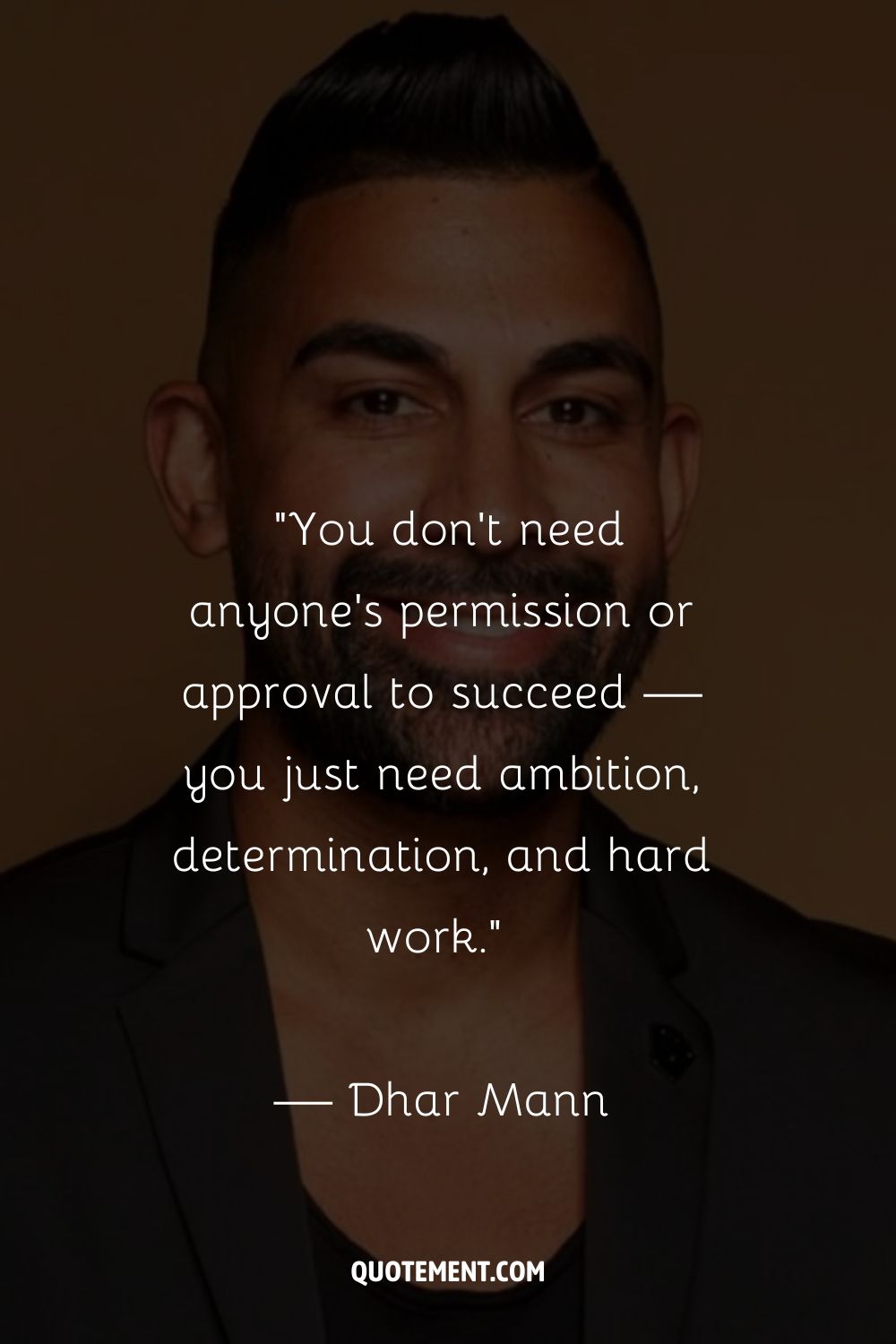 Dhar Mann exuding confidence in a black shirt
