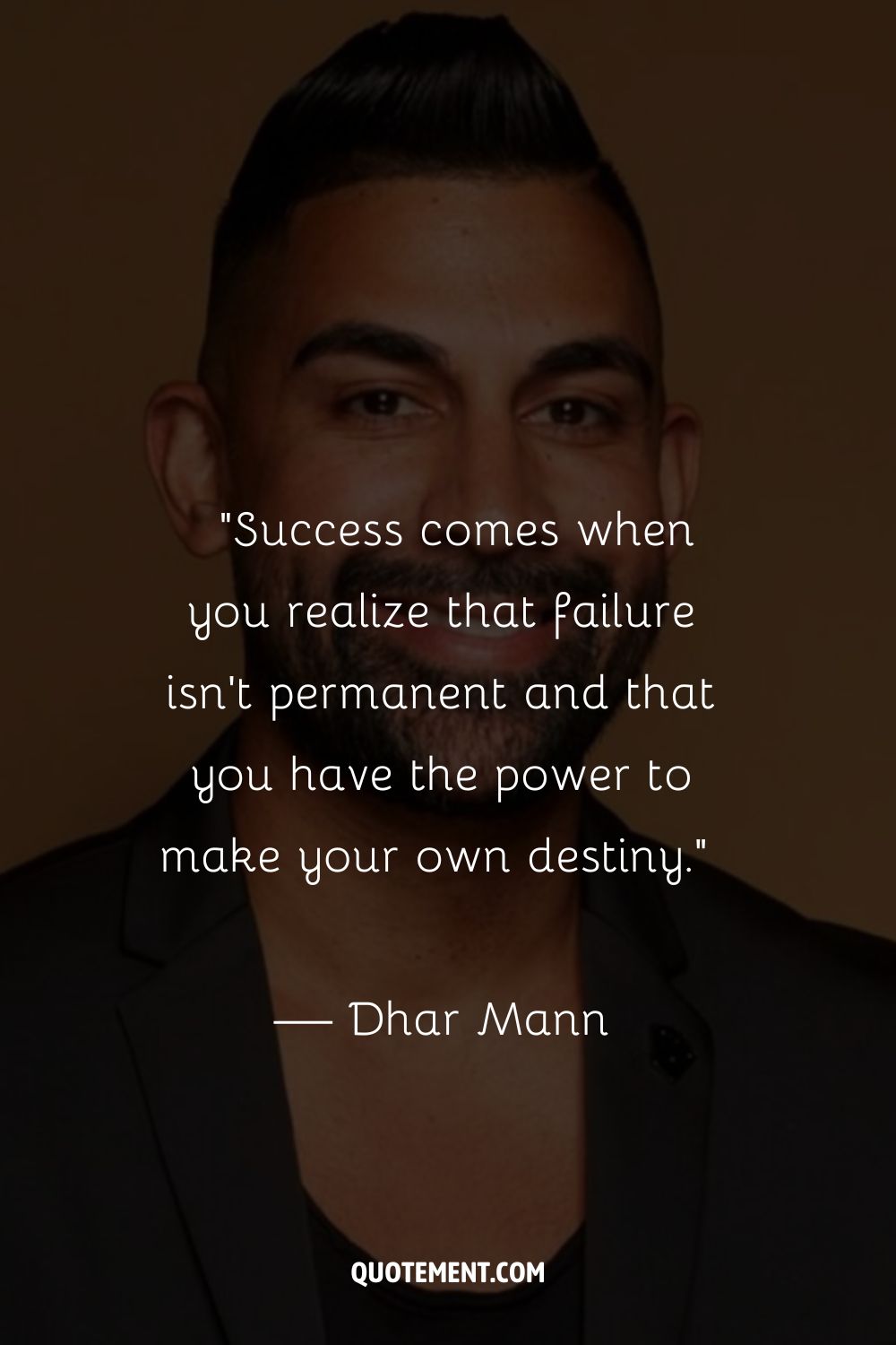 Dhar Man's portrait in a black shirt
