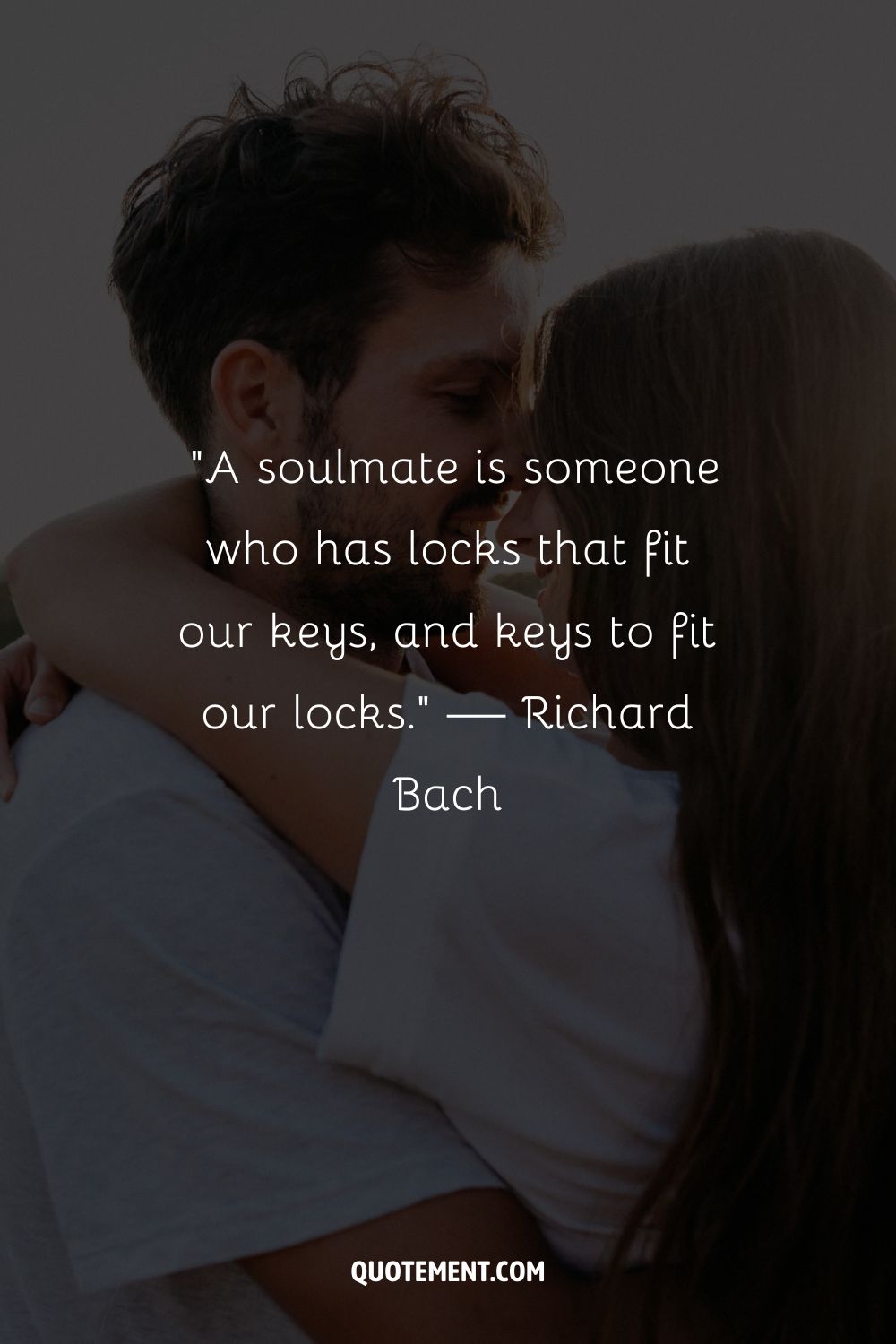 a couple sharing warm smiles and a loving hug representing the loveliest soulmate quote