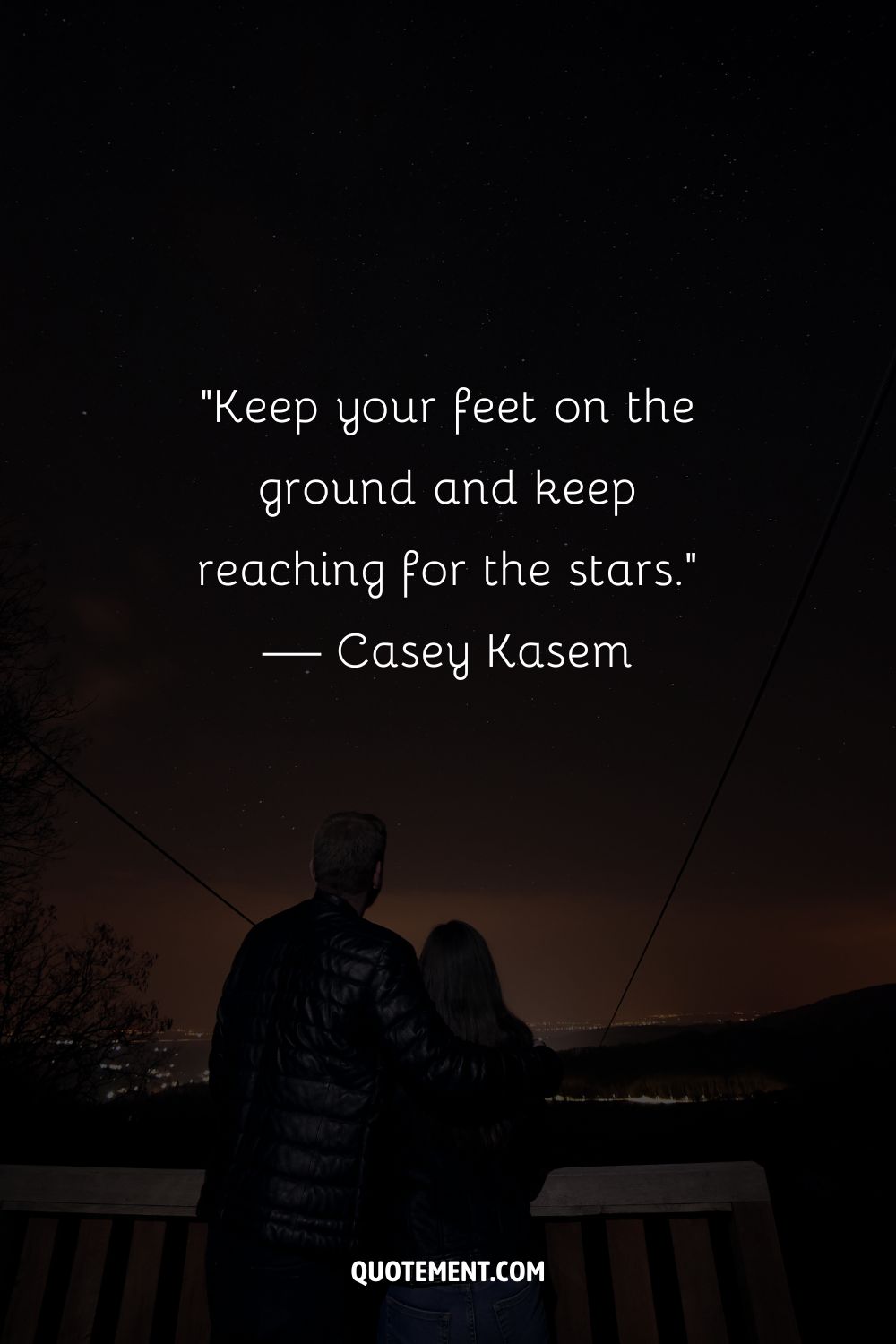 A couple gazing into a starry sky representing an inspiring reach for the stars quote

