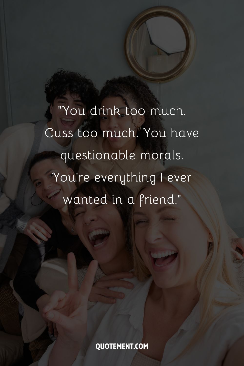 A diverse group of four friends laughing and posing for a selfie representing a funny quote for friends
