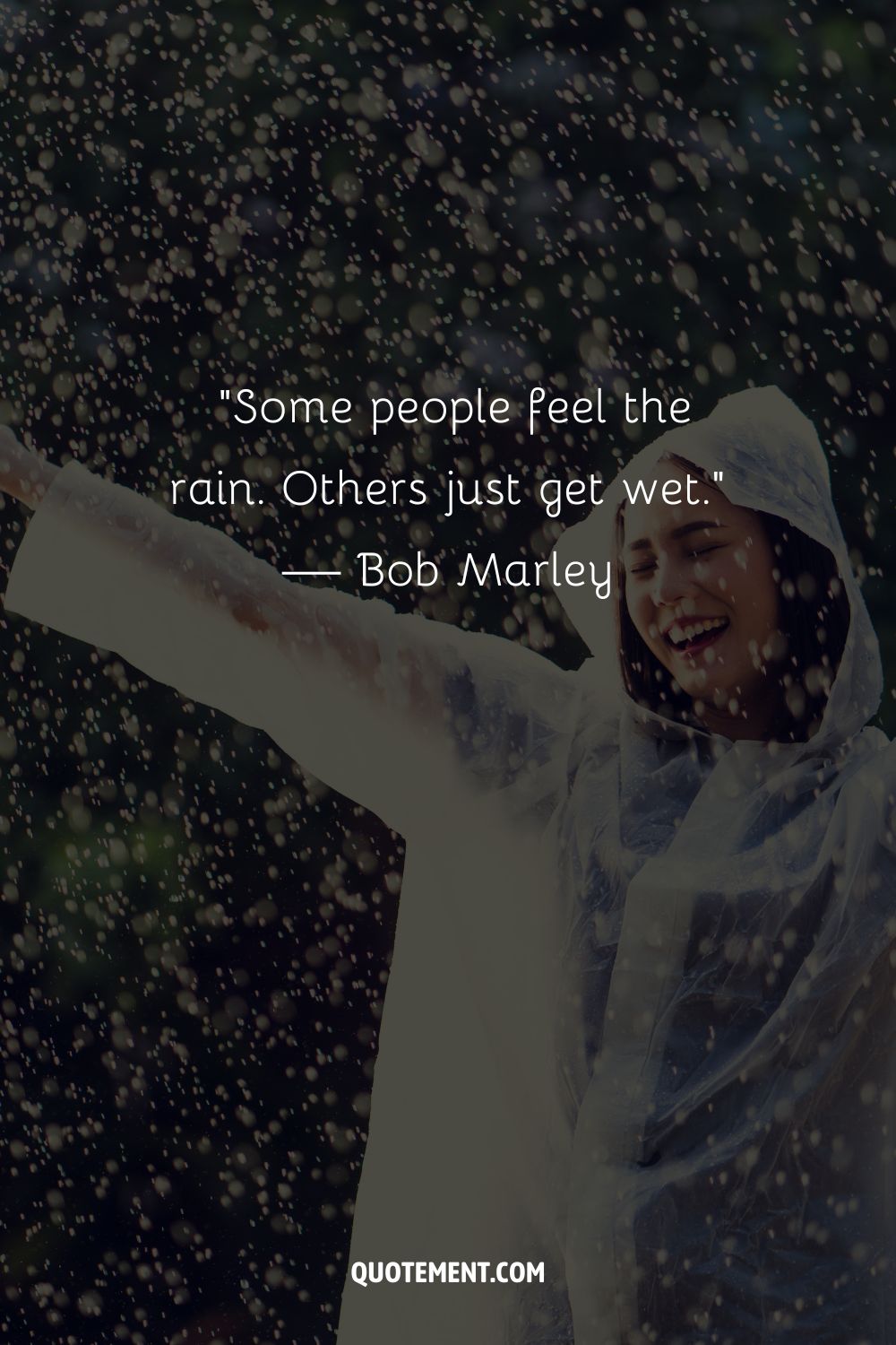 A joyful woman standing in the rain with arms raised representing an amazing rainy day quote
