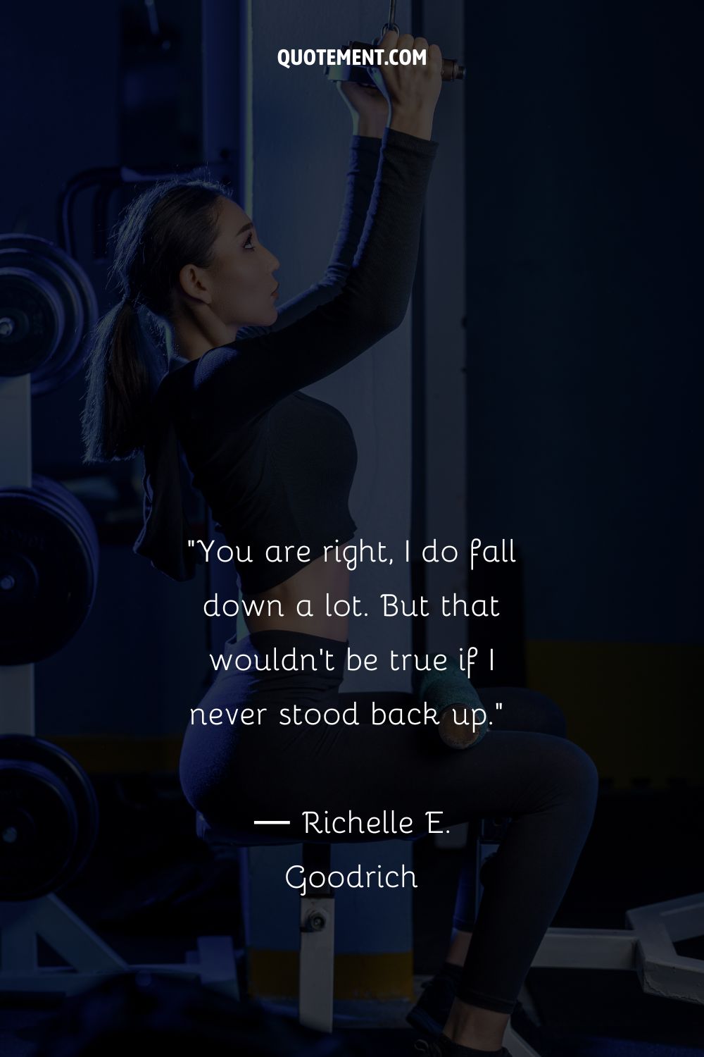 determined female athlete performing a pull-up
