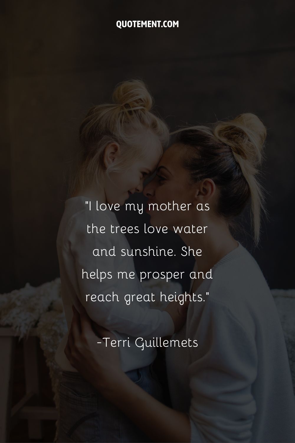A woman and a small girl with matching bun hairstyles share an embrace representing daughter love mom quote
