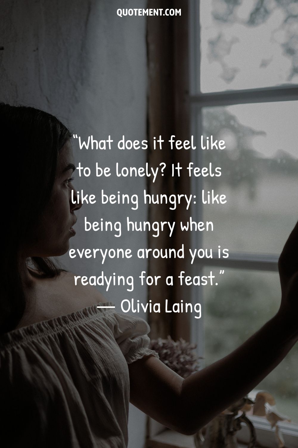 A girl standing by a window  representing a loneliness quote
