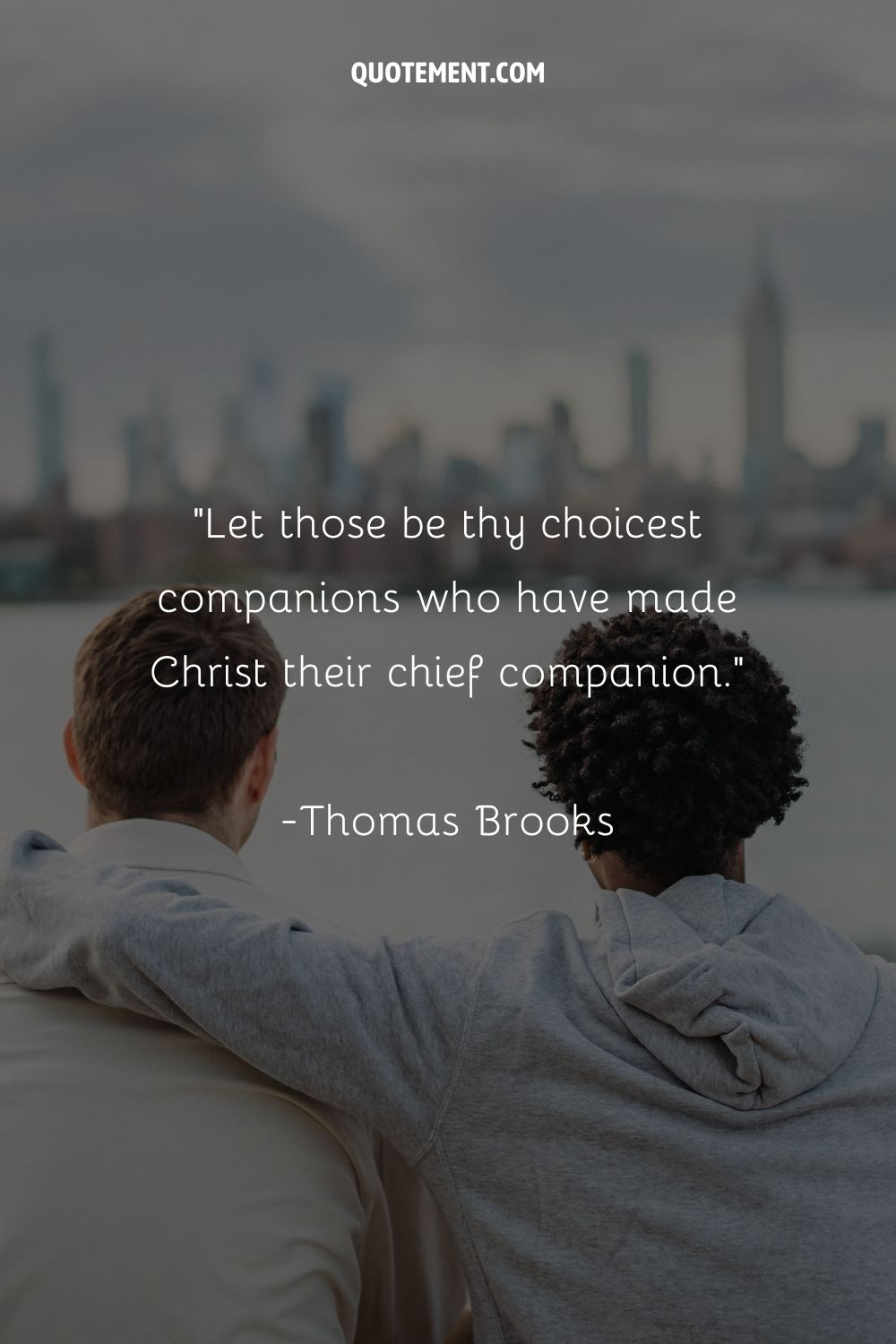 Two male friends sitting, one hugging the other, representing the best Christian friendship quote
