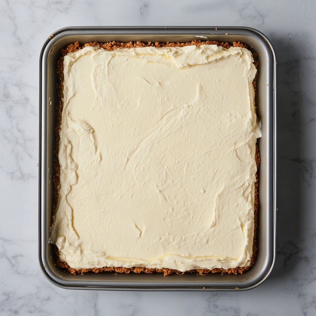 Cheesecake-Filling-Placed-On-Oreo-Crust